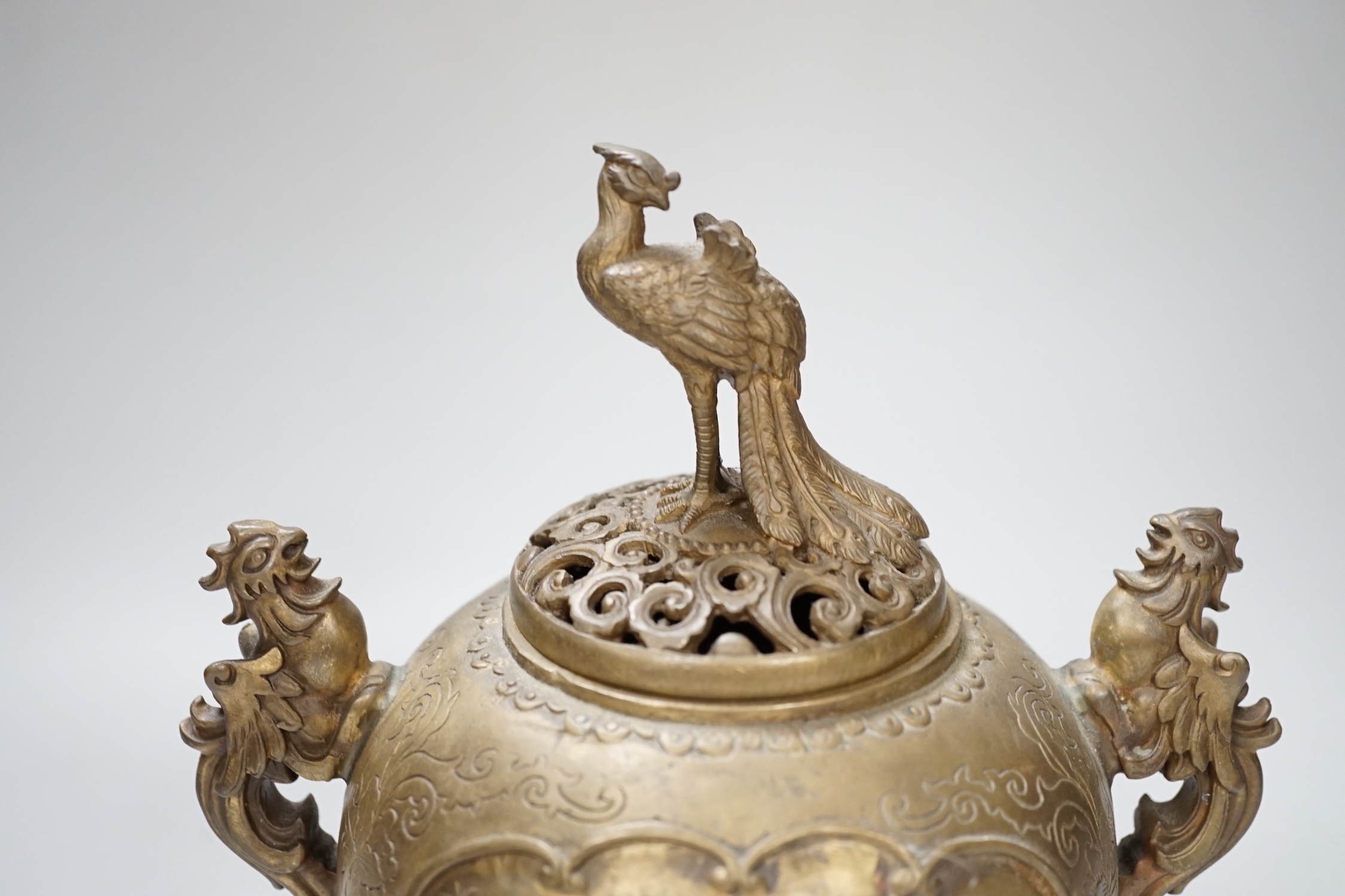 A Japanese bronze shi-shi footed censer and cover, 22cm high